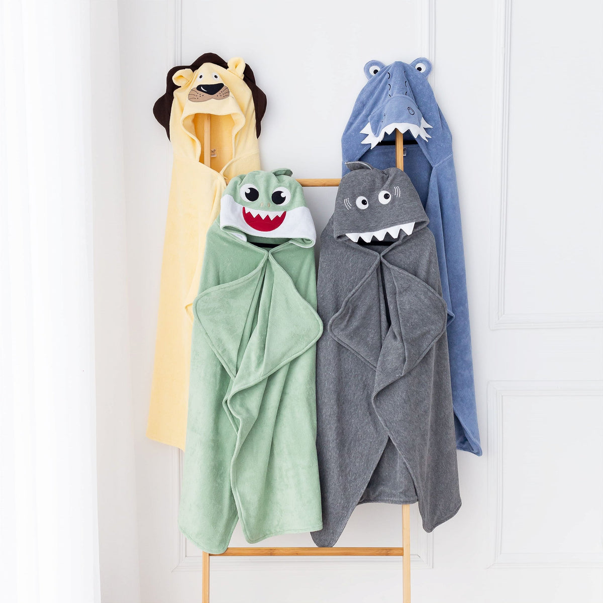 Animal hooded bath towels in lion and shark designs